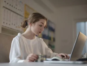 a woman researching Dubai’s freelance visa programs